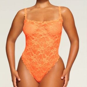 NWOT SKIMS Neon Orange Stretch Lace Intimates Thong Bodysuit